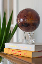Mars solar power rotating globe on book stack