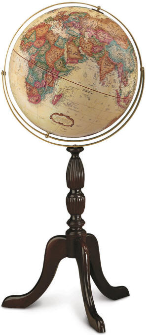 beige world globe on wooden floor pedestal