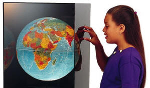 Girl looking at world globe