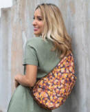 ameribag healthy back bag leopard print worn by woman smiling