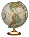 world globe on multi colored wood stand