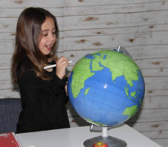 Geographer world globe female student